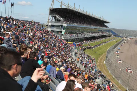 Gordon Shedden leads the field past the packed Rockingham grandstands